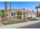 Desert home features mature palm trees, a red tile roof, a two-car garage, and low-maintenance desert landscaping at 2257 Lauren Dr, Las Vegas, NV 89134