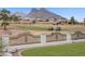 Scenic view overlooking the well-maintained golf course surrounded by lush greenery and trees, against a mountain backdrop at 2257 Lauren Dr, Las Vegas, NV 89134