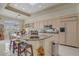 Spacious kitchen featuring a large island with seating, granite countertops, and stainless steel appliances at 2257 Lauren Dr, Las Vegas, NV 89134