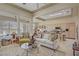 Bright and airy living room with large windows, neutral tones, and a seamless flow to the kitchen at 2257 Lauren Dr, Las Vegas, NV 89134