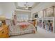 Spacious main bedroom with tray ceilings, plush carpet, and a cozy fireplace at 2257 Lauren Dr, Las Vegas, NV 89134