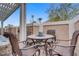 A cozy patio features a round table and comfortable seating, perfect for outdoor dining and relaxation at 2257 Lauren Dr, Las Vegas, NV 89134