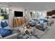 Bright living room featuring stylish furniture, a large window, and an open layout at 2501 Rofrano Pl, Henderson, NV 89044