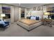 Serene main bedroom with neutral tones, ambient lighting, and large windows with outside views at 2501 Rofrano Pl, Henderson, NV 89044