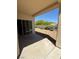 Covered patio provides shade to backyard featuring desert landscaping at 2562 Downeyville Ave, Henderson, NV 89052