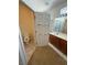 Well-lit bathroom featuring tile floors, shower and a separate toilet at 2562 Downeyville Ave, Henderson, NV 89052