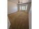 This bedroom offers plush carpeting and ample natural light from the bright windows at 2562 Downeyville Ave, Henderson, NV 89052