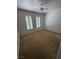 Bright bedroom featuring carpet floors, ceiling fan and bright shuttered windows at 2562 Downeyville Ave, Henderson, NV 89052