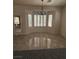 Cozy dining area with bay window, tile floor and pendant light fixture at 2562 Downeyville Ave, Henderson, NV 89052