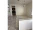 Open dining area featuring tile flooring and natural light from a window at 2562 Downeyville Ave, Henderson, NV 89052