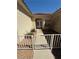 Close-up of the gated front entrance leading to a decorative front door and window at 2562 Downeyville Ave, Henderson, NV 89052