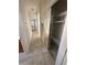 Hallway with tile floors, closet and access to other rooms in the home at 2562 Downeyville Ave, Henderson, NV 89052