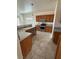 Bright kitchen featuring stainless steel appliances, wood cabinets, and tile flooring at 2562 Downeyville Ave, Henderson, NV 89052