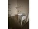 View of the utility sink and shelving in the laundry area at 2562 Downeyville Ave, Henderson, NV 89052