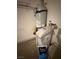 Image shows the water heater and water softener system at 2562 Downeyville Ave, Henderson, NV 89052