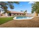 Inviting backyard with a pool, mature trees, and low-maintenance landscaping at 2620 E Harmon Ave, Las Vegas, NV 89121