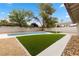 Lush backyard offering an in-ground pool, gravel, and artificial turf for easy upkeep at 2620 E Harmon Ave, Las Vegas, NV 89121