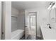 Modern bathroom with a soaking tub, herringbone floors, and sleek countertops at 2620 E Harmon Ave, Las Vegas, NV 89121