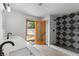 Modern bathroom featuring a walk-in shower, stylish tile, and a door to the backyard at 2620 E Harmon Ave, Las Vegas, NV 89121