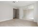 Bedroom with mirrored closet doors, neutral paint, carpet, and modern lighting at 2620 E Harmon Ave, Las Vegas, NV 89121