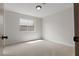 A carpeted bedroom features ample natural light and neutral paint at 2620 E Harmon Ave, Las Vegas, NV 89121