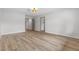 A spacious bedroom with wood-look floors boasts neutral paint, recessed lighting, and a bright, airy feel at 2620 E Harmon Ave, Las Vegas, NV 89121