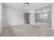 A sunlit bedroom features mirrored closet doors and neutral carpeting at 2620 E Harmon Ave, Las Vegas, NV 89121