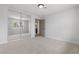 Neutral bedroom featuring carpet, a closet with mirrored doors, and a modern light fixture at 2620 E Harmon Ave, Las Vegas, NV 89121