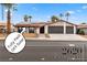 Charming home with desert landscaping, two-car garage, and solar panels at 2620 E Harmon Ave, Las Vegas, NV 89121