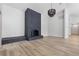 Modern fireplace with gray brick facade and decorative lighting in a well-lit living space at 2620 E Harmon Ave, Las Vegas, NV 89121