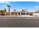 Charming single-story home with a well-manicured front yard and a spacious driveway leading to the garage at 2620 E Harmon Ave, Las Vegas, NV 89121