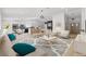 Bright, open living space with modern furnishings, hardwood floors, and a seamless flow to the kitchen at 2620 E Harmon Ave, Las Vegas, NV 89121