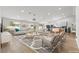Open-concept living room featuring modern decor, hardwood floors, and a view of the kitchen at 2620 E Harmon Ave, Las Vegas, NV 89121
