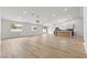 Spacious open-concept living area with hardwood floors, recessed lighting, and a modern kitchen at 2620 E Harmon Ave, Las Vegas, NV 89121