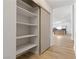 Organized pantry with sliding doors provides ample storage space near the kitchen at 2620 E Harmon Ave, Las Vegas, NV 89121