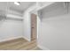 A walk-in closet is equipped with shelving and hanging rods for organization at 2620 E Harmon Ave, Las Vegas, NV 89121