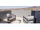 This outdoor balcony offers chairs and an incredible mountain view at 2650 Skylark Trail St, Henderson, NV 89044