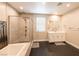 Primary bathroom features a soaking tub, walk-in shower, dual sinks and modern fixtures at 2650 Skylark Trail St, Henderson, NV 89044