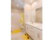 Well-lit bathroom with double vanity, modern fixtures, and a shower-tub combination at 2650 Skylark Trail St, Henderson, NV 89044