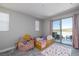 Cozy bedroom featuring carpet, a bed and sliding glass door to a balcony at 2650 Skylark Trail St, Henderson, NV 89044