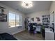 A bedroom bathed in natural light with a spacious desk and comfortable workspace at 2650 Skylark Trail St, Henderson, NV 89044