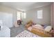 Cute bedroom with carpet, bright windows, polka dot rug and a closet at 2650 Skylark Trail St, Henderson, NV 89044