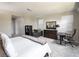 Bright bedroom with a work area, dresser, carpet flooring and natural light at 2650 Skylark Trail St, Henderson, NV 89044