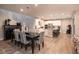 Inviting dining area adjacent to a modern kitchen, complete with stylish furniture and decor at 2650 Skylark Trail St, Henderson, NV 89044