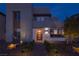 Modern two-story home with a brick pathway leading to a glass-accented front door and professionally landscaped yard at 2650 Skylark Trail St, Henderson, NV 89044