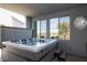 A hot tub with steps is located under a covered patio, with a view from the adjacent windows at 2650 Skylark Trail St, Henderson, NV 89044