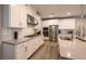 Modern kitchen boasts white cabinetry, stainless steel appliances, and ample counter space at 2650 Skylark Trail St, Henderson, NV 89044