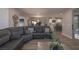 Inviting living room showcasing an open floorplan, modern decor, and seamless flow to the kitchen at 2650 Skylark Trail St, Henderson, NV 89044