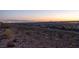 Wide shot of neighborhood, showing the lights of the Las Vegas Strip on the horizon at dusk at 2650 Skylark Trail St, Henderson, NV 89044