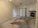 Simple living room with a fireplace, sliding glass doors, and basic features at 2679 Magic Moon Ln, Las Vegas, NV 89146